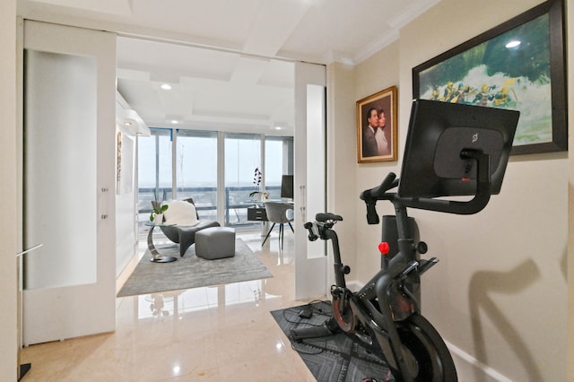 exercise room with a water view, crown molding, expansive windows, and light tile patterned floors