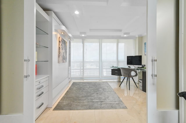 home office with light tile patterned floors and floor to ceiling windows