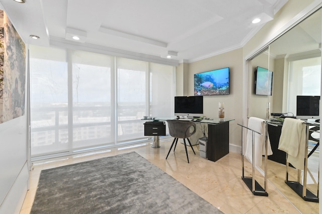 office area with a raised ceiling and ornamental molding