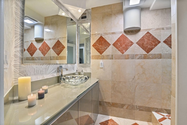 bathroom featuring sink, tile walls, and tasteful backsplash