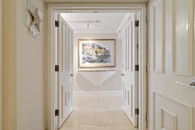 2800 S Ocean Blvd Unit 14-H, Boca Raton, FL 33432 - corridor featuring rail lighting, ornamental molding, and baseboards