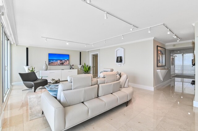 2800 S Ocean Blvd Unit 14-H, Boca Raton, FL 33432 - living area with rail lighting, ornamental molding, baseboards, and light marble finish floors