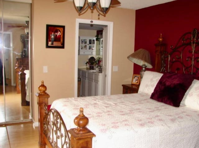 bedroom with hardwood / wood-style floors