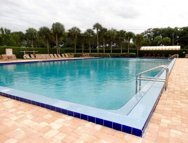 view of swimming pool featuring a patio area