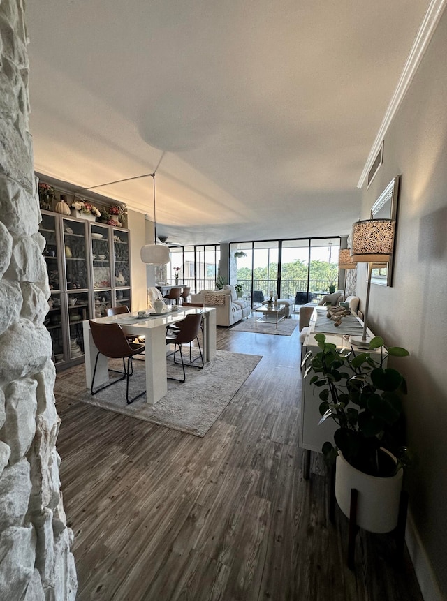 living room featuring dark hardwood / wood-style flooring and ornamental molding