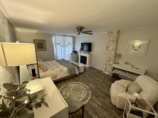 2816 N 46th Ave Unit J682, Hollywood, FL 33021 - bedroom with ornamental molding, wood finished floors, a glass covered fireplace, and a ceiling fan