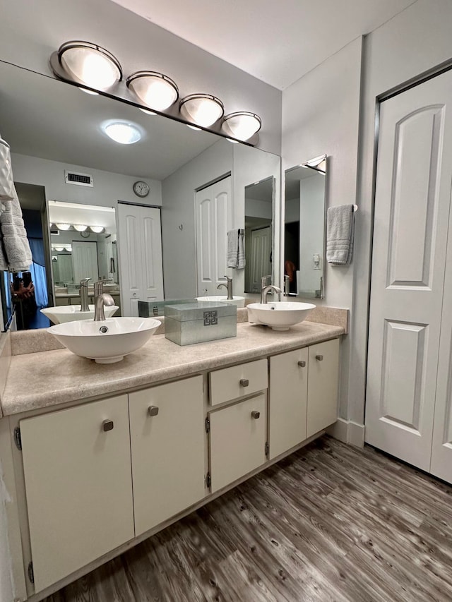 bathroom featuring wood-type flooring and vanity