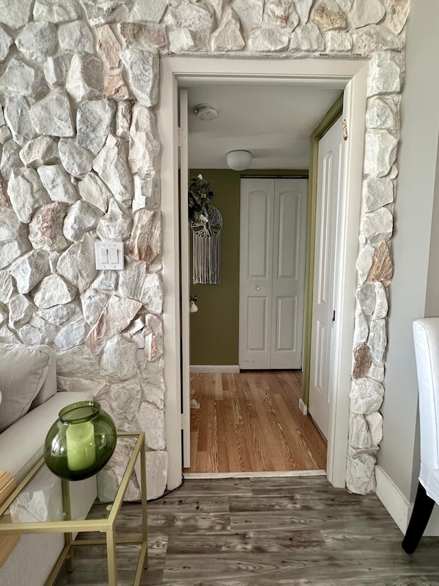 hallway featuring hardwood / wood-style flooring