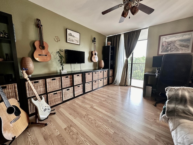 interior space featuring ceiling fan and light wood-type flooring