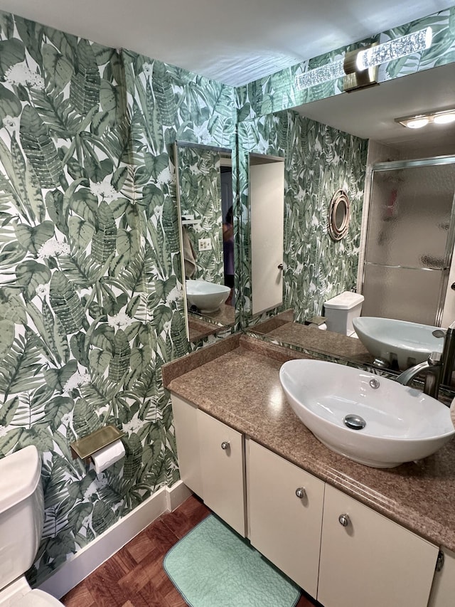 2816 N 46th Ave Unit J682, Hollywood, FL 33021 - full bathroom with wallpapered walls, a shower stall, toilet, and vanity