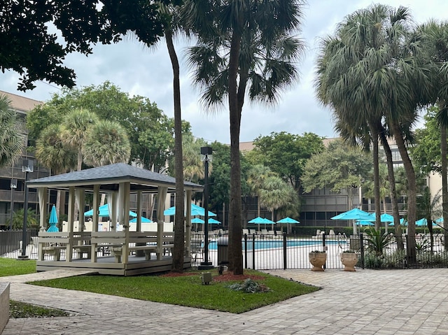 view of property's community with a gazebo and a pool