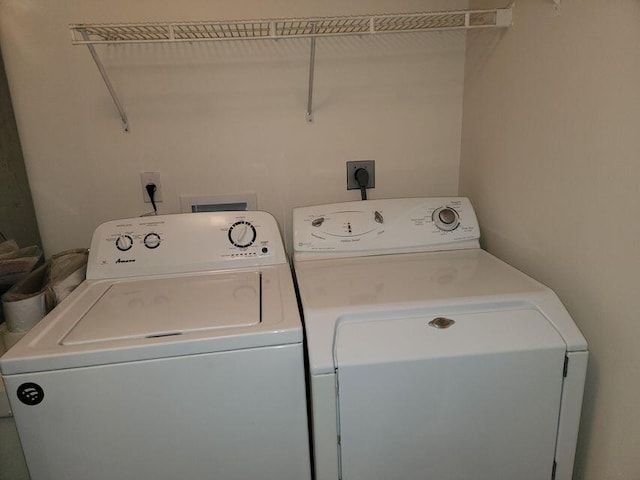 laundry room featuring washer and clothes dryer