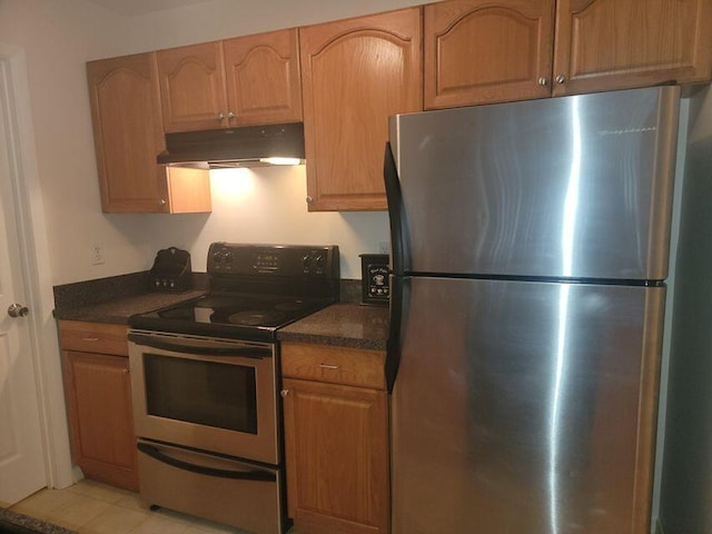 kitchen featuring light tile patterned floors and appliances with stainless steel finishes