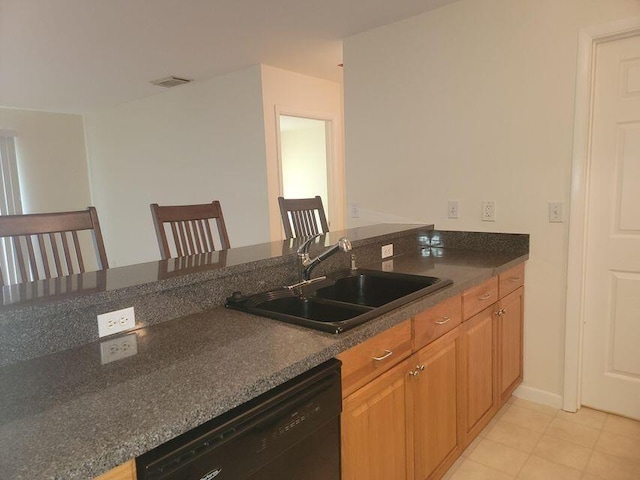 kitchen with kitchen peninsula, sink, and black dishwasher