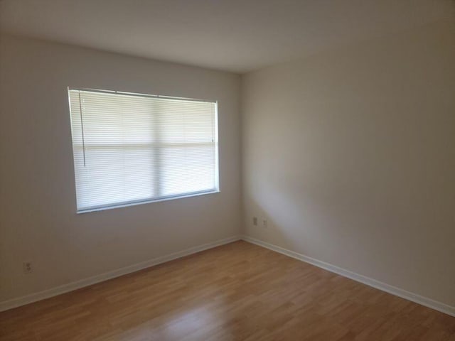 unfurnished room featuring light hardwood / wood-style flooring