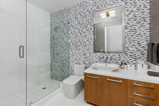 bathroom featuring tile walls, backsplash, vanity, a shower with shower door, and toilet