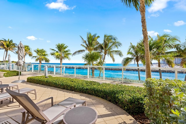 exterior space with a water view and a view of the beach