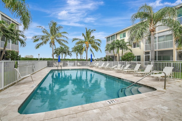 view of swimming pool with a patio