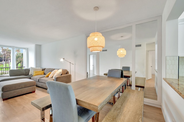 dining room with light hardwood / wood-style floors