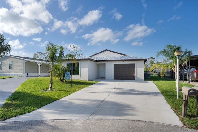 single story home featuring a garage and a front lawn