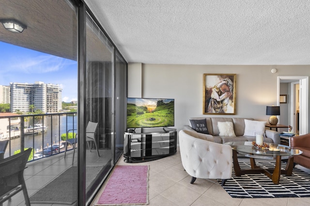 899 Jeffery St Unit 604, Boca Raton, FL 33487 - living room with light tile patterned flooring and a textured ceiling