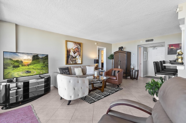 899 Jeffery St Unit 604, Boca Raton, FL 33487 - living area featuring light tile patterned floors and a textured ceiling