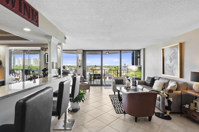 899 Jeffery St Unit 604, Boca Raton, FL 33487 - living room with light tile patterned floors and a textured ceiling