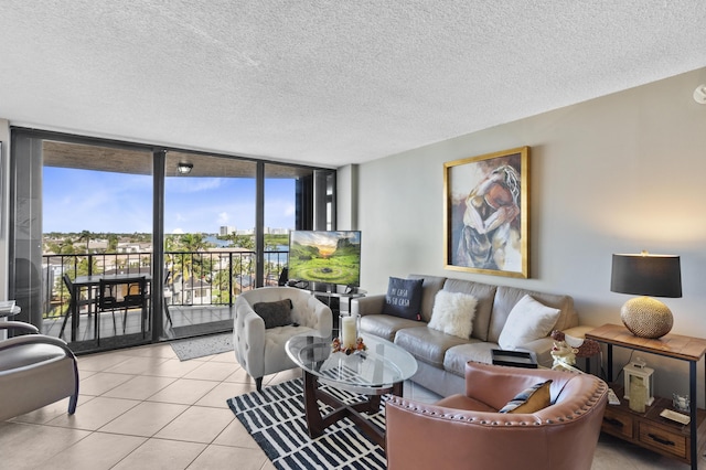 899 Jeffery St Unit 604, Boca Raton, FL 33487 - living room with expansive windows, light tile patterned flooring, and a textured ceiling