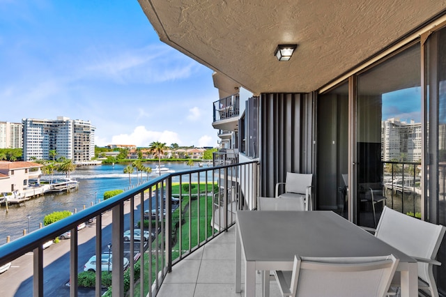 balcony featuring a water view