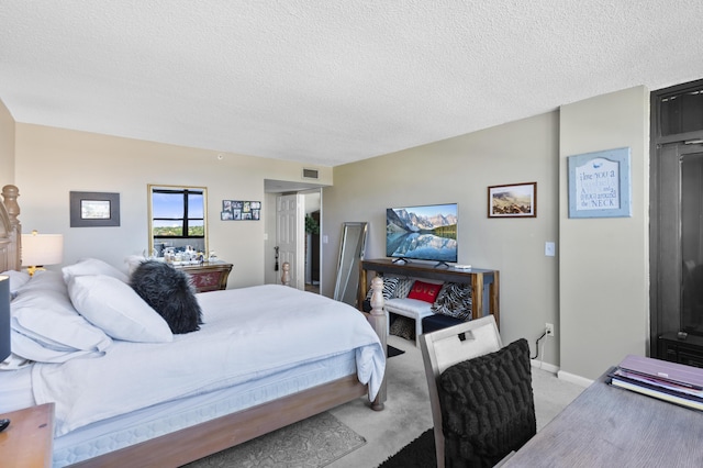 899 Jeffery St Unit 604, Boca Raton, FL 33487 - bedroom with a textured ceiling, light colored carpet, and baseboards