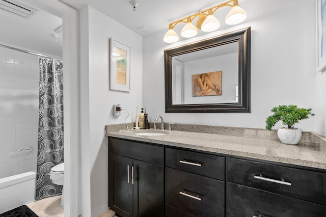 full bathroom featuring vanity, toilet, and shower / tub combo with curtain