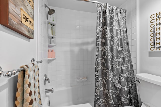 bathroom with toilet and shower / bath combination with curtain