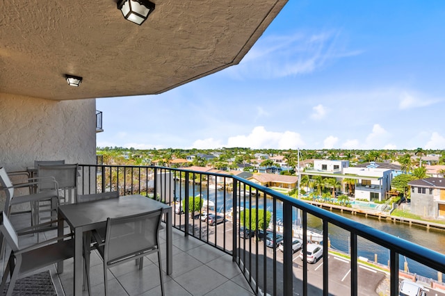 balcony featuring a water view