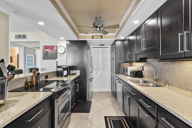 899 Jeffery St Unit 604, Boca Raton, FL 33487 - kitchen with a sink, stainless steel appliances, ceiling fan, light stone countertops, and light tile patterned flooring