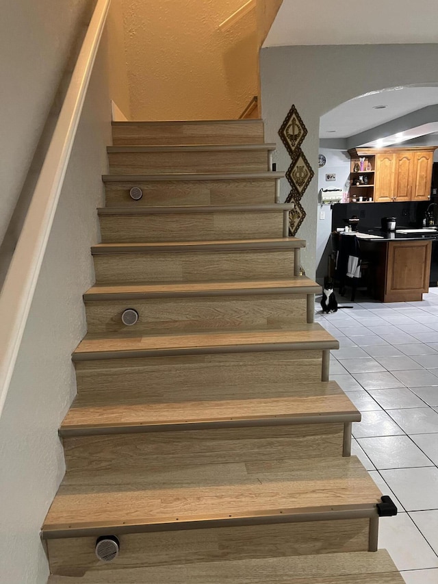 20 Laredo Pl Unit 2-1, Davie, FL 33324 - stairs featuring tile patterned flooring and arched walkways