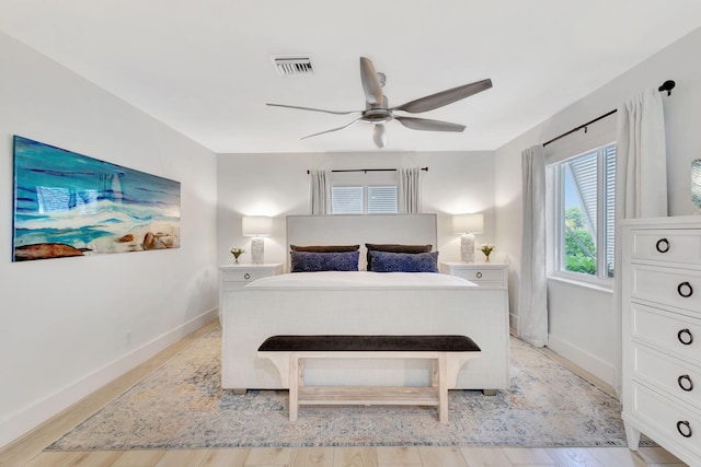 bedroom featuring light wood-type flooring and ceiling fan