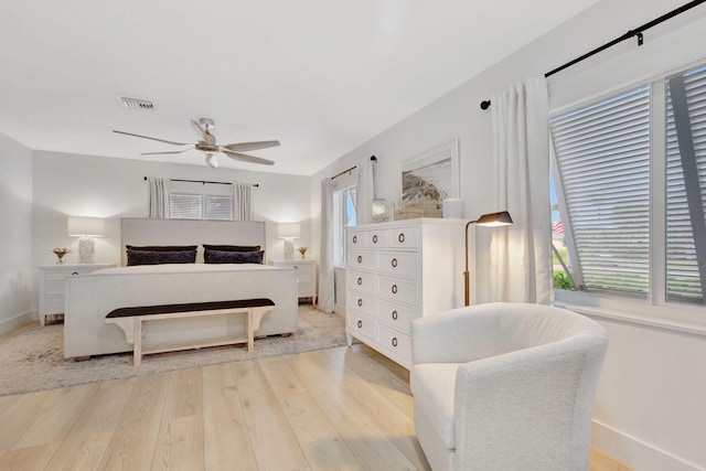 bedroom with light hardwood / wood-style flooring and ceiling fan