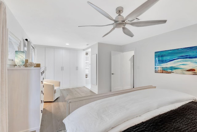 bedroom featuring ceiling fan and light hardwood / wood-style floors