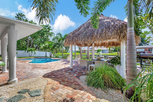 view of pool featuring a gazebo and a patio