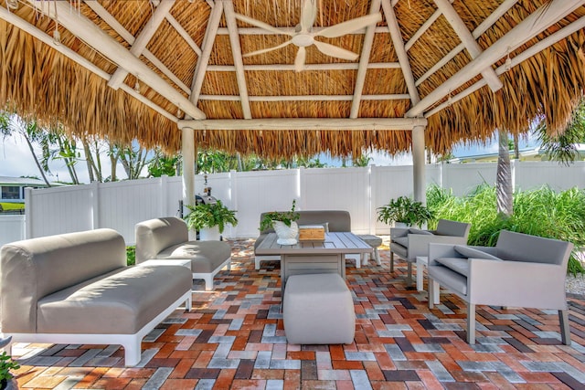 view of patio / terrace with a gazebo, an outdoor living space, and ceiling fan