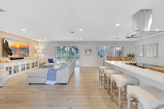 living room with light hardwood / wood-style flooring