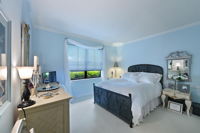 carpeted bedroom featuring crown molding