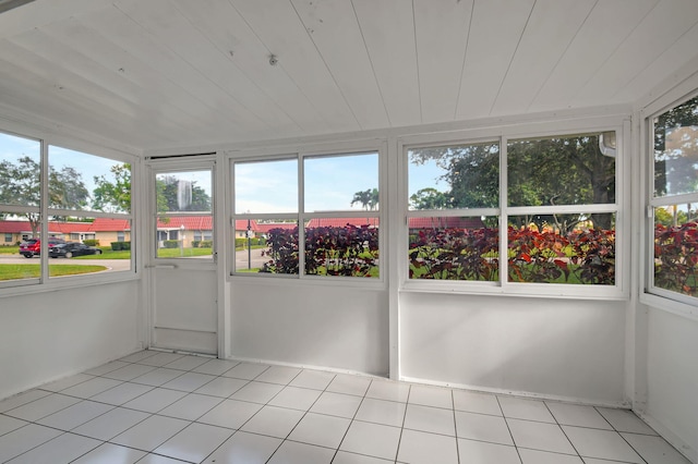 unfurnished sunroom featuring a wealth of natural light