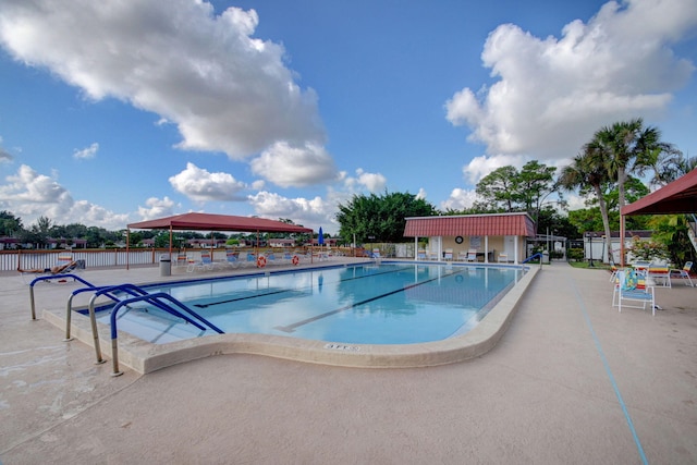 view of swimming pool featuring a patio area