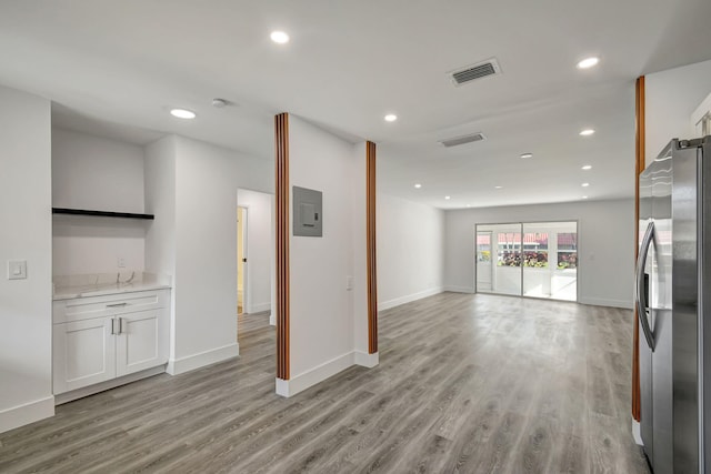 unfurnished living room with light hardwood / wood-style flooring