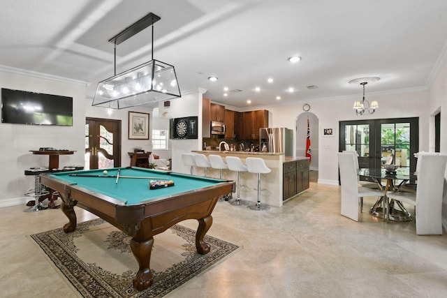 recreation room with pool table, ornamental molding, and french doors