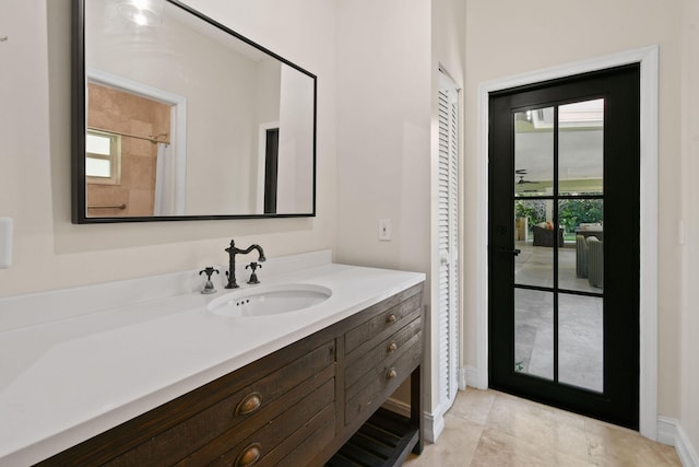 bathroom with vanity and tile patterned floors