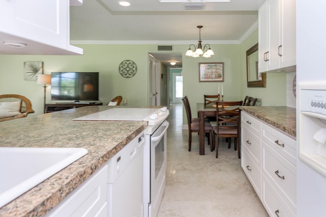 kitchen with white cabinets, crown molding, white appliances, and hanging light fixtures