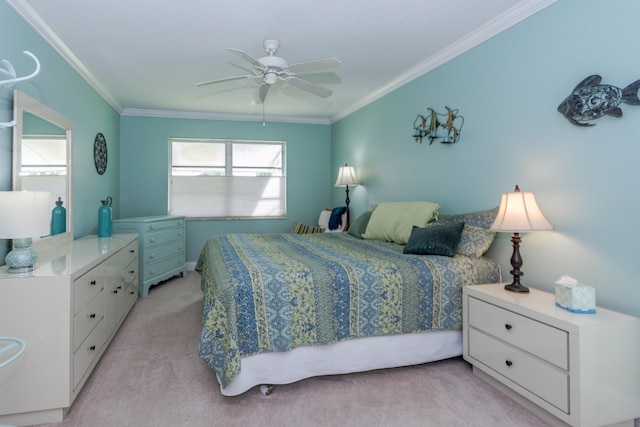 carpeted bedroom with ceiling fan and crown molding