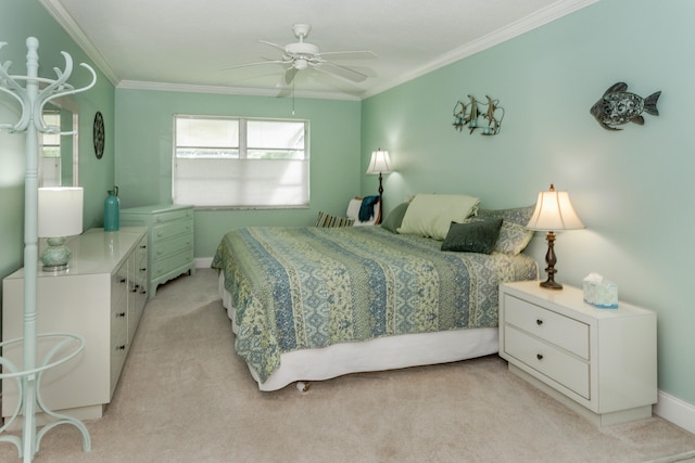 bedroom featuring ceiling fan, light colored carpet, and ornamental molding